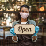 Woman,Coffee,Shop,Owner,With,Face,Mask,Opens,After,Lockdown